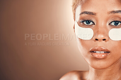 Buy stock photo Black woman, eyes and portrait for beauty patch on a mockup background for collagen dermatology. Aesthetic model person in studio for skincare, self care and facial skin glow with gel mask space