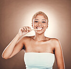 Dental, brushing teeth and smile with portrait of black woman and toothbrush for beauty, cleaning and self care. Health, oral hygiene and wellness with girl for morning routine in studio background