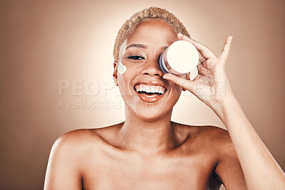 Buy stock photo Black woman, portrait and face for beauty cream container on brown background for dermatology. Happy aesthetic model smile in studio for skincare, self care and facial cosmetic glow with healthy skin