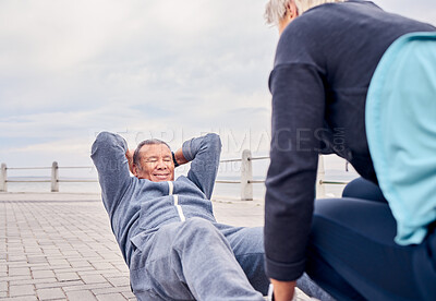 Buy stock photo Fitness, exercise and sit ups with a senior couple training outdoor together for an active lifestyle of wellness. Workout, health or core with a mature man and woman outside on the promenade