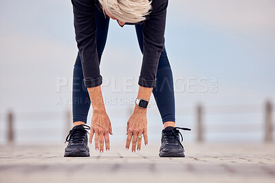 Buy stock photo Woman stretching hands, legs and reaching ground for exercise, training and healthy wellness outdoors. Sports lady bending for warm up, body workout and fitness at beach promenade 