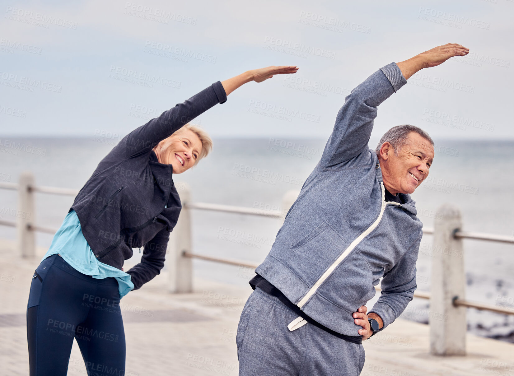 Buy stock photo Stretching, fitness and happy senior couple on promenade for exercise, healthy body and wellness in retirement. Sport, pilates and elderly man and woman ready for warm up, cardio workout and training