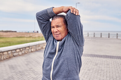 Buy stock photo Senior man, exercise and stretching arms at promenade beach for fitness, wellness or training. Male warm up body outdoor for workout, sports performance and start healthy cardio marathon of mobility
