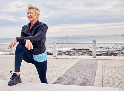 Buy stock photo Senior woman, fitness and stretching at beach sidewalk for energy, wellness and happy workout on sky mockup. Elderly female, exercise and rest at sea promenade for training, sports run and motivation