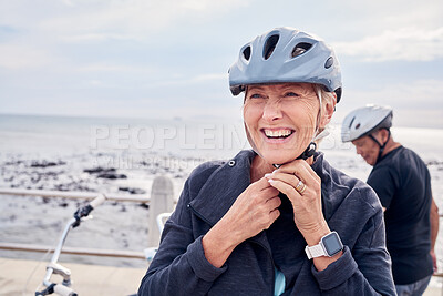 Buy stock photo Happy senior woman, bicycle and helmet on holiday ride at beach for fitness workout with man. Smile on face, happiness and health, cycling exercise for mature couple on ocean vacation in Australia.