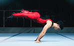 Gymnast, handstand and man on gym floor for training, balance and wellness with muscle, strong body and night. Gymnastics, athlete and exercise in studio for competition, goals and fitness for sport