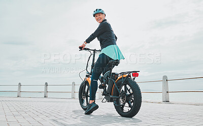 Buy stock photo Back, portrait and bike with senior woman, promenade and exercise for healthy lifestyle, balance and happiness. Face, mature female and athlete cycling, ocean and mockup with training and fitness