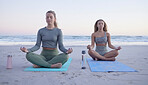 Yoga, meditation and zen with woman friends on the beach for fitness, mental health or wellness. Training, exercise or chakra with female and personal trainer meditating legs crossed on the sand