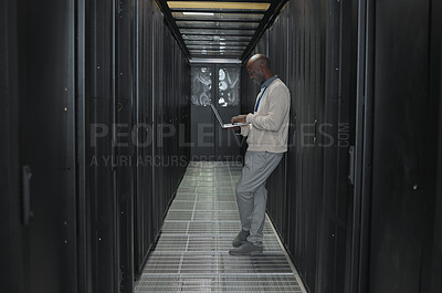 Buy stock photo Laptop, network and data center with IT black man for research, engineer working in  dark server room. Computer, cybersecurity and analytics with male programmer problem solving or troubleshooting