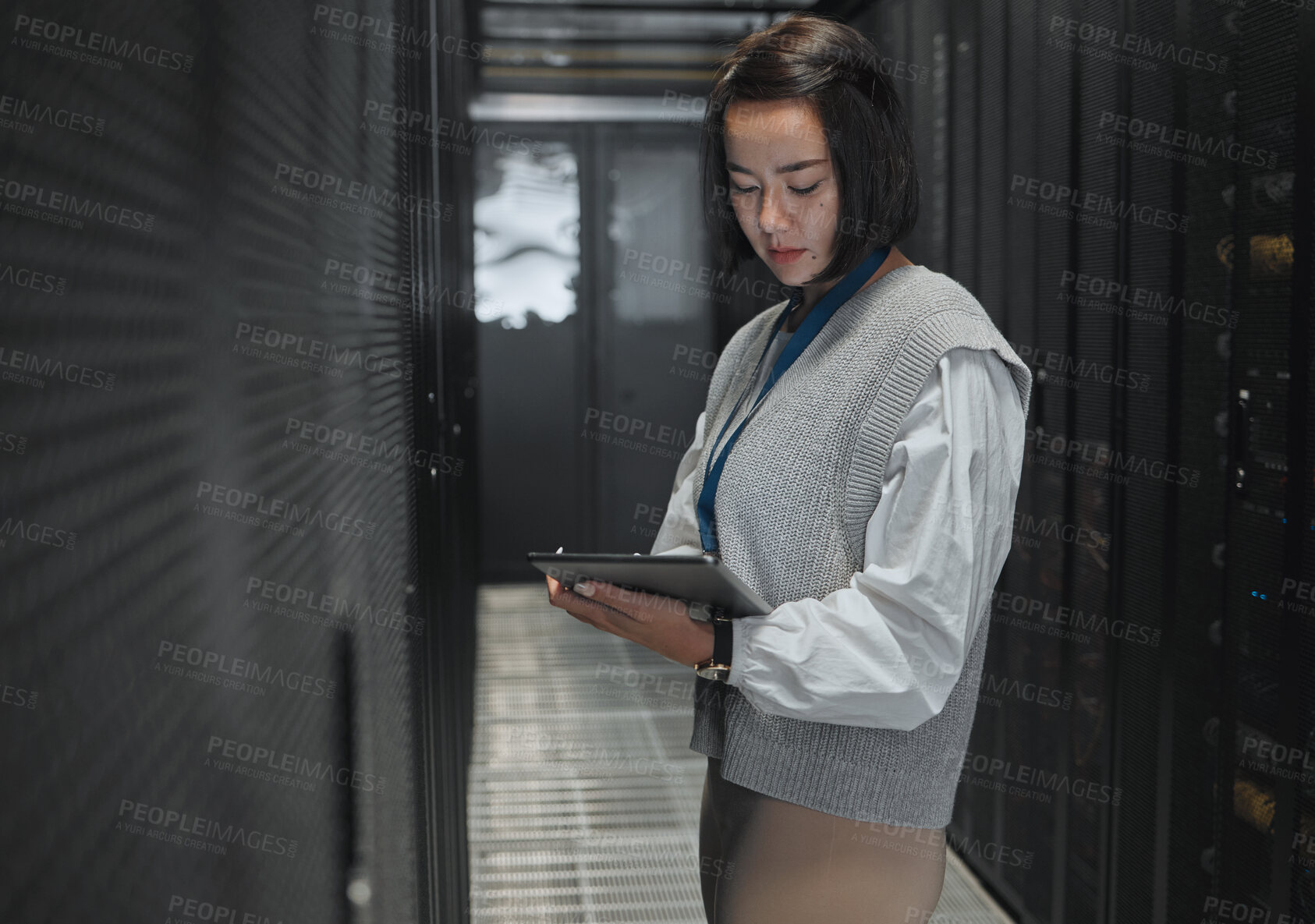 Buy stock photo Tablet, server room and dashboard with a programmer asian woman at work on a computer mainframe. Software, database and information technology with a female coder working alone on a cyber network