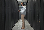 Tablet, server room and programming with a developer asian woman at work on a computer mainframe. Software, database and information technology with a female coder working alone on a cyber network