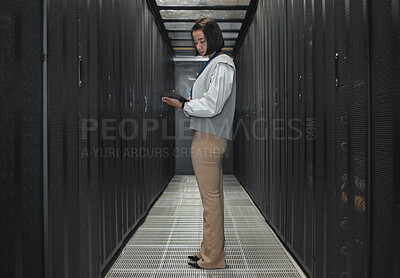 Buy stock photo Tablet, server room and programming with a developer asian woman at work on a computer mainframe. Software, database and information technology with a female coder working alone on a cyber network