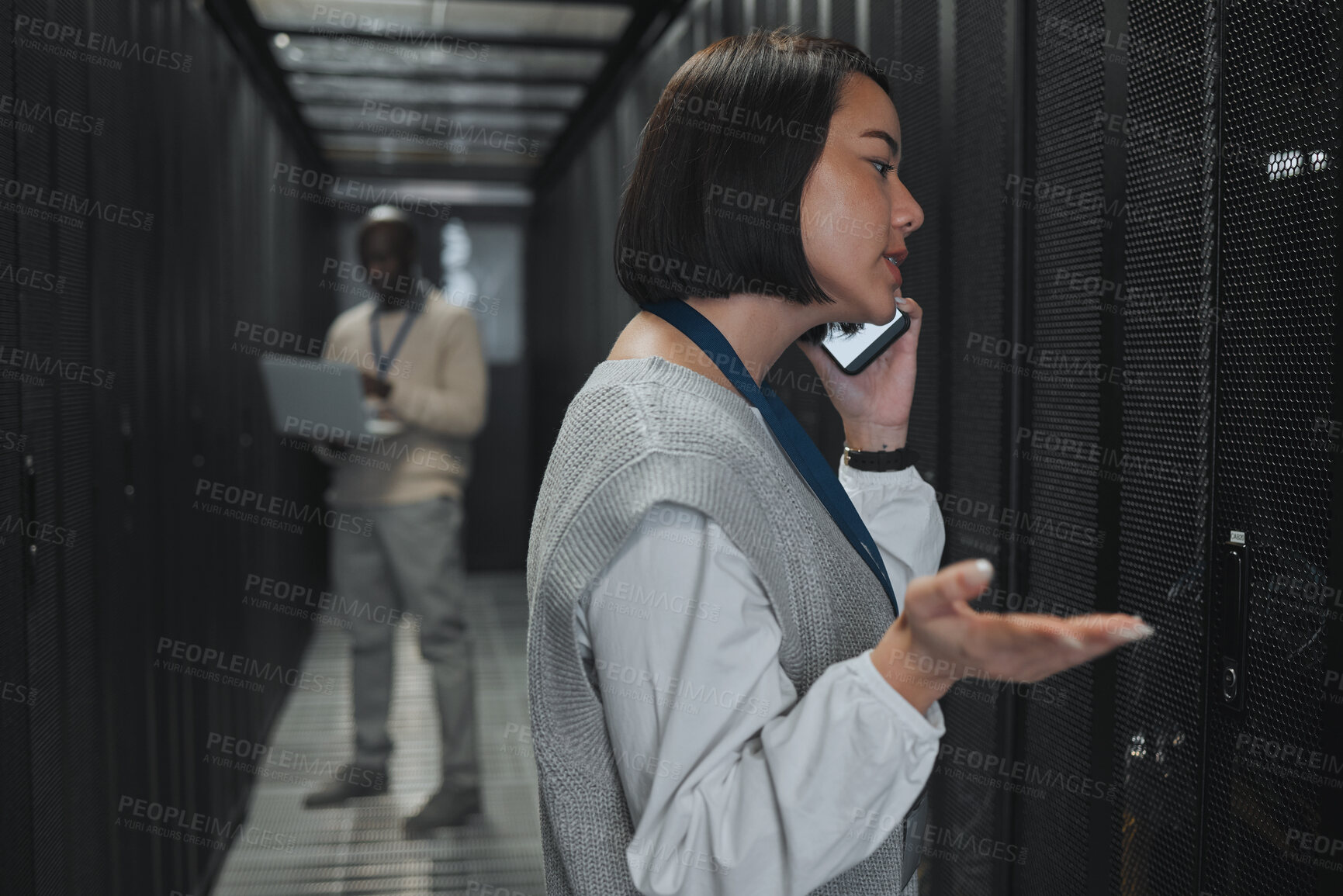 Buy stock photo Phone call, technician and woman in a server room for maintenance, repairs or data analysis. Systems, technology and Asian female engineer on mobile conversation while checking power of cable service