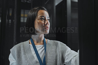 Buy stock photo Serious, maintenance or IT woman in server room for analysis, engineer working in data center. Thinking, cybersecurity and girl programmer with tech for problem solving, diagnose or troubleshooting