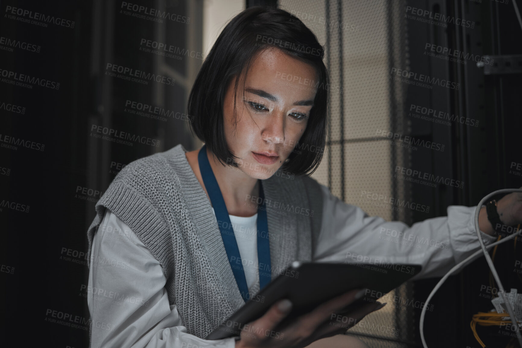Buy stock photo Tablet, server room and communication with a programmer asian woman at work on a computer mainframe. Software, database and information technology with a female coder working alone on a cyber network
