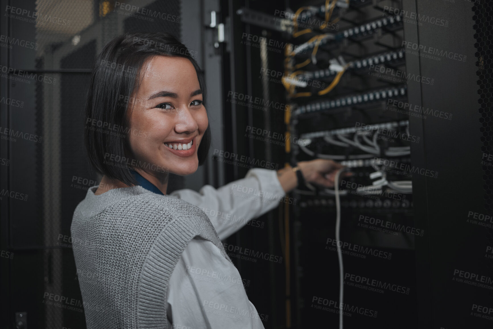 Buy stock photo Asian woman, portrait smile and technician by server for cabling, networking or system maintenance at office. Happy female engineer smiling in cable service, power or data management or admin control