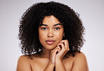 Beauty, skincare and portrait of a black woman with cosmetics isolated on a grey studio background. Serious, young and face of a model with a fresh afro, cosmetology and elegant on a backdrop