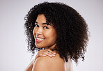 Black woman, smile and afro in studio portrait with beauty, wellness and cosmetic skincare glow by background. Young gen z model, african and hair care with clean face, natural and healthy aesthetic