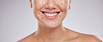 Face smile, dental and teeth of woman in studio isolated on a gray background. Skincare makeup, cosmetics and lips, mouth and oral hygiene of happy female model with veneers, invisalign and wellness.