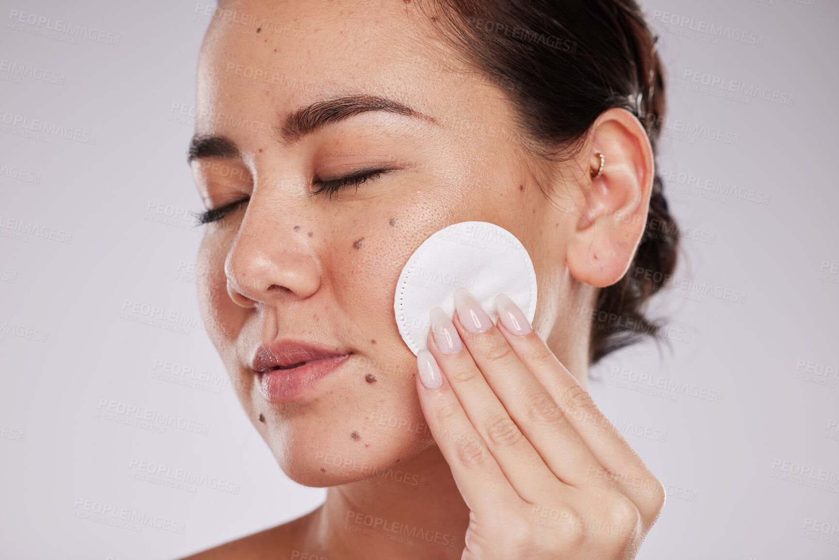 Buy stock photo Skincare cotton, face and woman with eyes closed in studio isolated on gray background. Makeup hygiene, beauty aesthetics and closeup of female model with facial pad or product for cleaning cosmetics