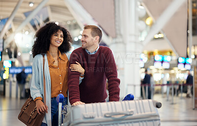 Buy stock photo Travel, happy and love with interracial couple in airport for vacation, journey and transportation. Relax, smile and luggage with man and black woman on holiday trip for tourism, flight or departure