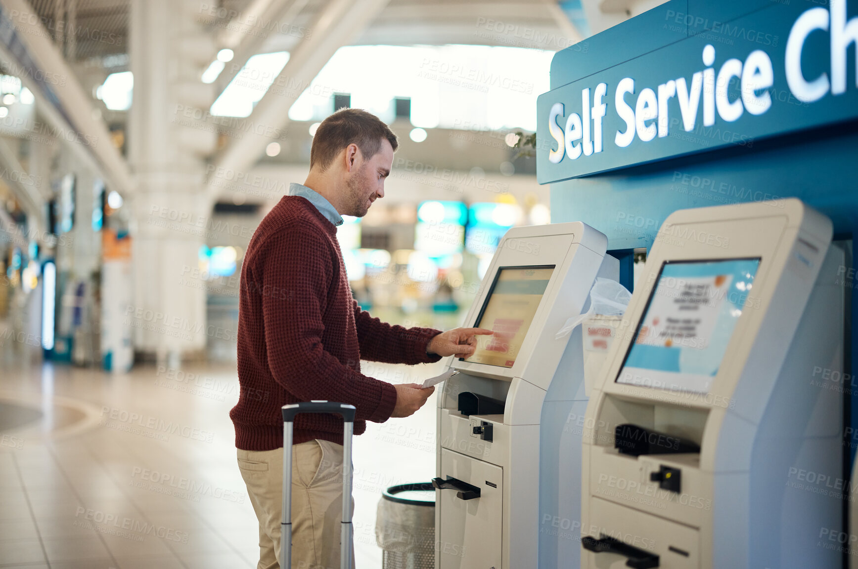 Buy stock photo Man, airport and self service kiosk for check in, ticket registration or online boarding pass. Male traveler by terminal machine for travel application, document or booking flight with luggage