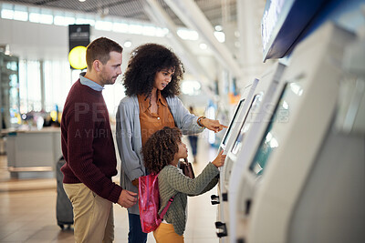 Buy stock photo Family, self service and travel at airport for check in, registration or booking flight online together. Mother, father and child at kiosk for ticket and planning traveling vacation, trip or journey