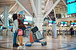 Airport, flight schedule and family with suitcase trolley for holiday, vacation or immigration travel and time check. Luggage of diversity parents or mother and father with child or kid in lobby