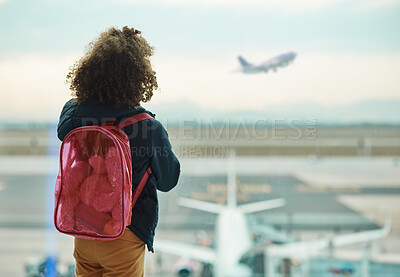 Buy stock photo Girl child, looking and airport window for greeting, goodbye and focus for airplane, international transport or travel. Kid, back and watch takeoff by glass for global immigration, young and African