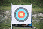 Bullseye target paper, outdoor and board at shooting range for weapon training, aim and accuracy. Sports, archery and poster for gun, bow and arrow at academy for police, army or security for goal