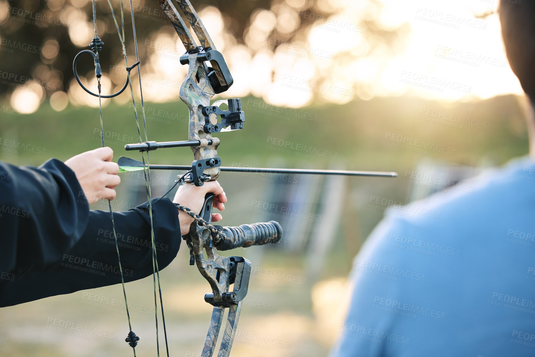Buy stock photo Archery, closeup and target training with an instructor on field for hobby, aim and control. Arrow, practice and archer people together outdoor for hunting, precision and weapon, shooting competition