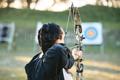 Buy stock photo Archery, shooting range and target for sports training with a woman outdoor for bow practice. Archer athlete person with focus on field for competition or game to aim arrow for action and bullseye