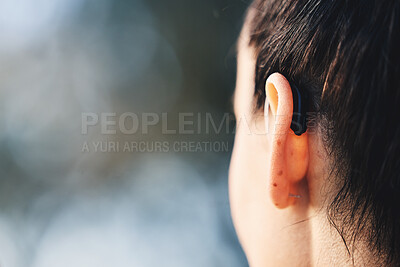 Buy stock photo Woman, ear and hearing aid implant for disability with free space for mockup or advertising. Deaf person with medical device for listening to sound or audio with technology for wellness outdoor