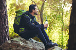 Relax, hiking or water bottle in forest, nature woods or fitness environment for break, electrolytes or healthcare wellness. Hiker man, backpacker or sports drink in rest, recovery or thirsty workout