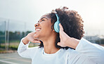 Freedom, fitness and music for black woman training at court, happy and relax with wellness track. Sports, podcast and girl smile with radio, playlist or song during exercise, training and workout