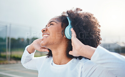 Buy stock photo Freedom, fitness and music for black woman training at court, happy and relax with wellness track. Sports, podcast and girl smile with radio, playlist or song during exercise and workout