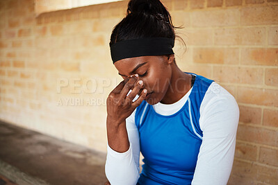 Buy stock photo Headache, fitness and black woman in pain during run, exercise or workout against brick wall background. Sports, migraine and girl suffering with ache, discomfort and fatigue during cardio routine 