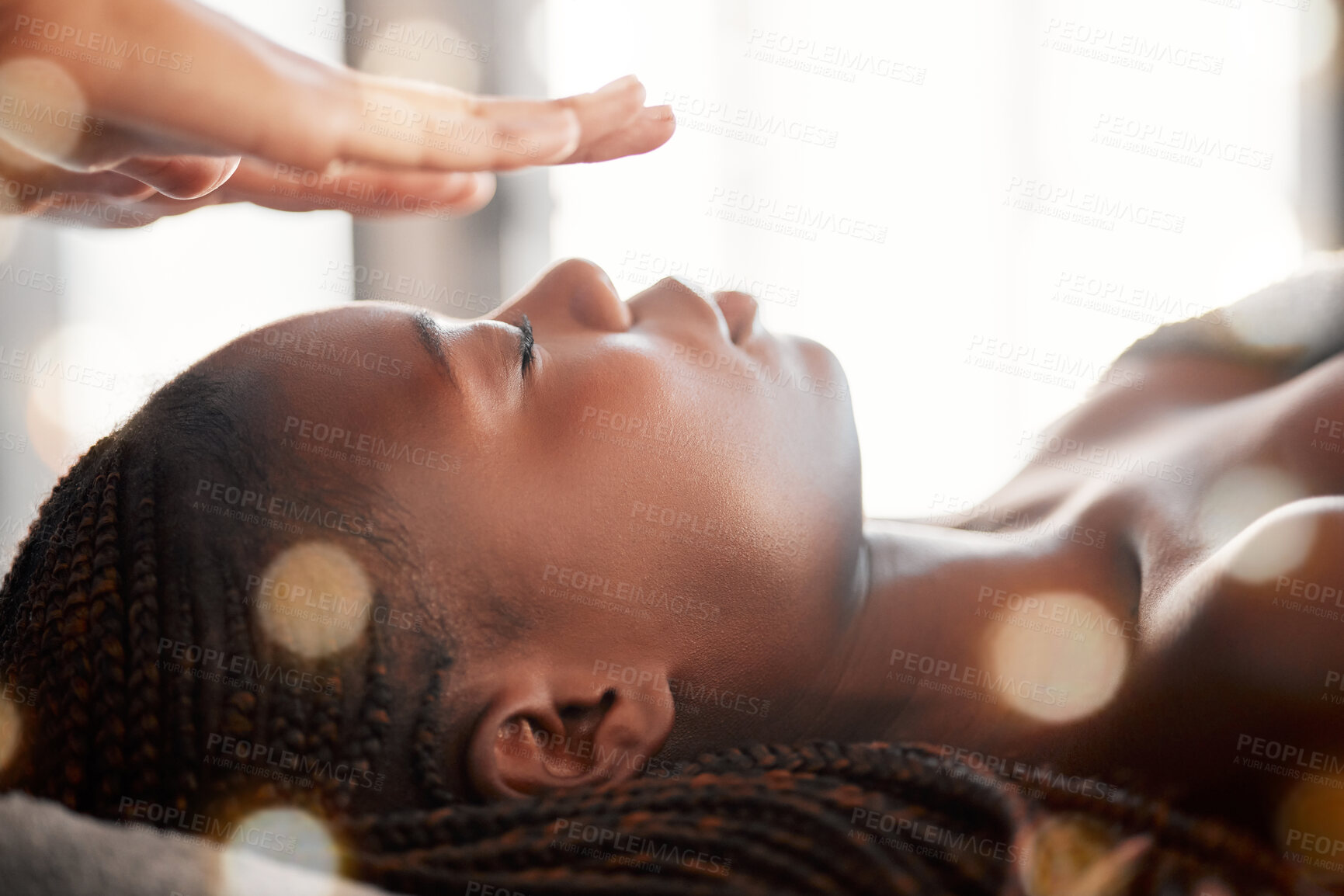 Buy stock photo Black woman, relax and reiki spa treatment of a young female ready for facial. Skincare, beauty and salon wellness clinic with client feeling calm and zen from massage and holistic dermatology