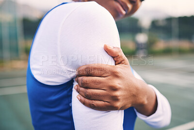 Buy stock photo Arm injury, sport pain and netball athlete on a outdoor sports court with joint or muscle problem. Training, exercise and black woman hands holding arms with workout and wellness issue from accident
