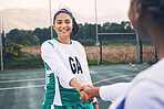 Woman, sports and smile for handshake, partnership or friends in fun game on the court together. Happy sporty female shaking hands with competitor or player for training match, fitness or workout