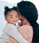 Mother, baby girl and happy child in a house with mom hug and support in the morning. Kid, toy block and mama holding infant with trust in a house with parent love and care together with bonding