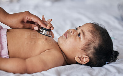 Buy stock photo Healthcare, stethoscope and sick baby on a bed for a consultation in a children medical clinic. Infant girl kid with a cold, flu or illness getting a wellness examination or checkup at the hospital.