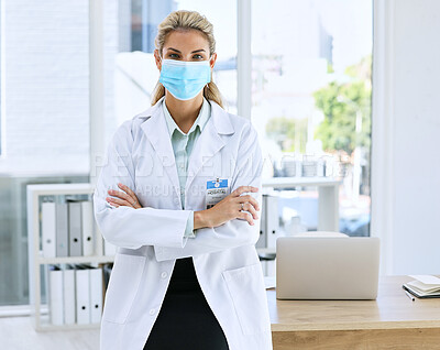 Buy stock photo Woman, doctor and portrait with mask and arms crossed standing in confidence for healthcare by laptop office desk. Confident or proud female medical professional in medicine ready for medicare help