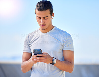 Buy stock photo Phone, fitness and man texting on social media or streaming music online during morning exercise or workout routine. Person, web and athlete using a mobile training app or website to track health