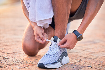 Buy stock photo Closeup, outdoor and man with fitness, shoelace and runner with wellness, training and healthy lifestyle. Zoom, male athlete and guy with smartwatch, tying shoes and exercise for workout or endurance