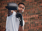 Fitness, boxing and portrait of a black man in gym doing a intense cardio workout with gloves. Sports, exercise and African male boxer athlete training or practicing for match, fight or competition.
