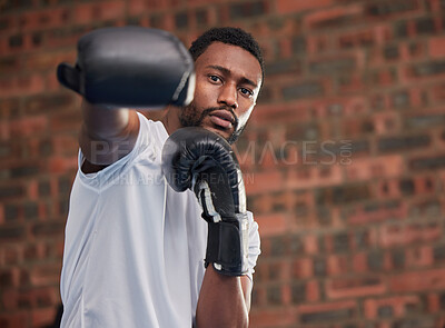 Buy stock photo Fitness, boxing and portrait of a black man in gym doing a intense cardio workout with gloves. Sports, exercise and African male boxer athlete training or practicing for match, fight or competition.