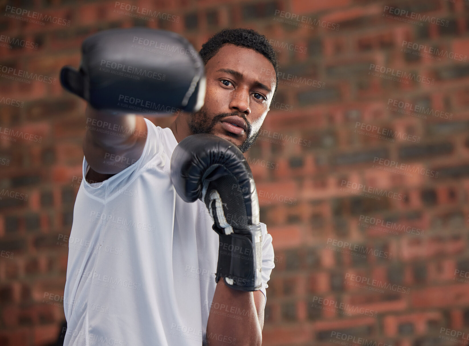 Buy stock photo Fitness, boxing and portrait of a black man in gym doing a intense cardio workout with gloves. Sports, exercise and African male boxer athlete training or practicing for match, fight or competition.