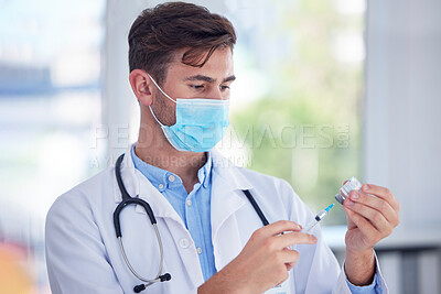 Buy stock photo Man, doctor and hands with face mask, vaccine or syringe for cure, illness or medication at the hospital. Male medical professional extracting medicine from vial for covid immunization or disease