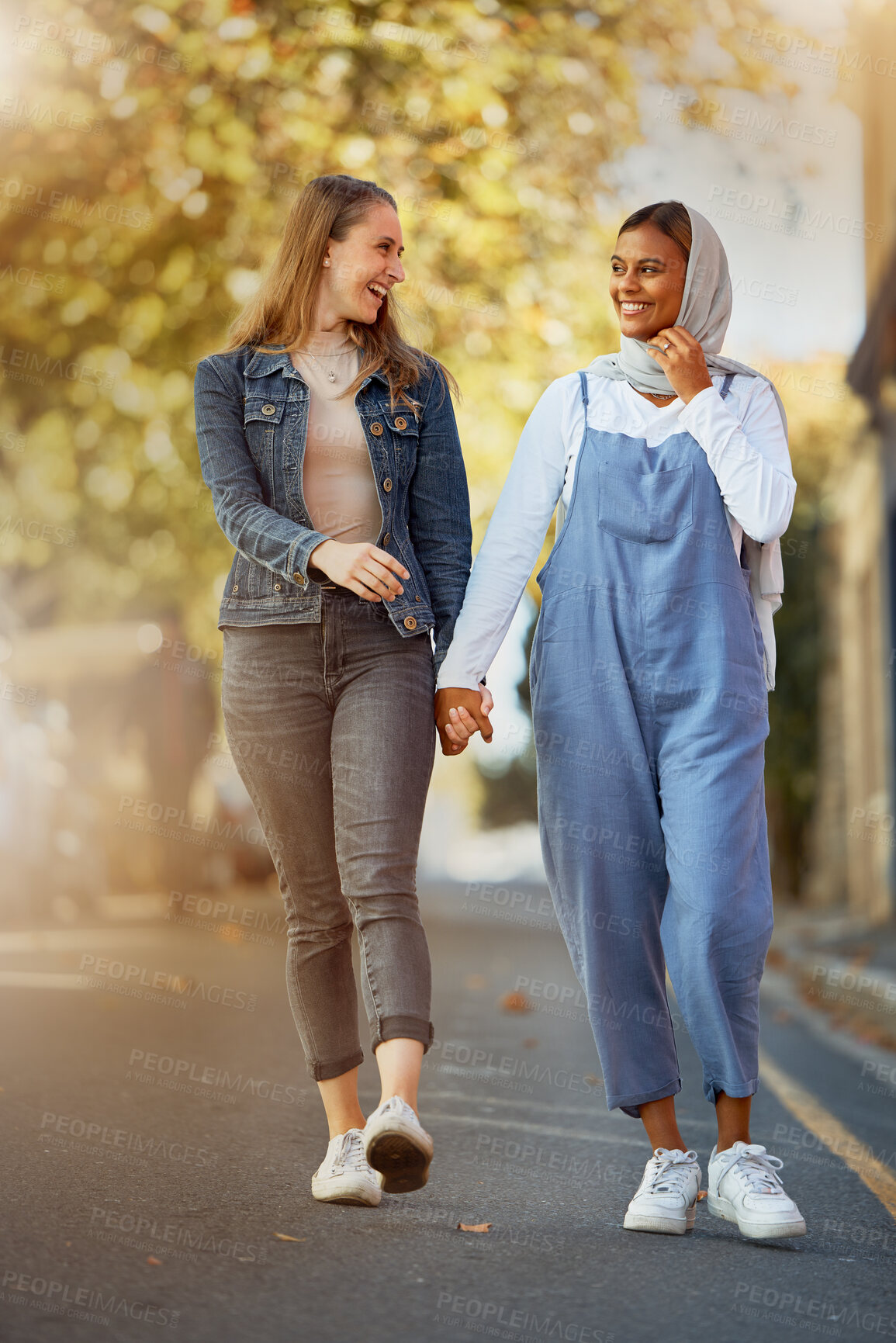 Buy stock photo Friends, happy and holding hands with women in road for support, spring and travel together. Community, diversity and smile with girls walking in street path for relax, social and solidarity 
